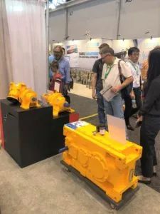 Visitors at IMTS at Transcyko stand looking at products